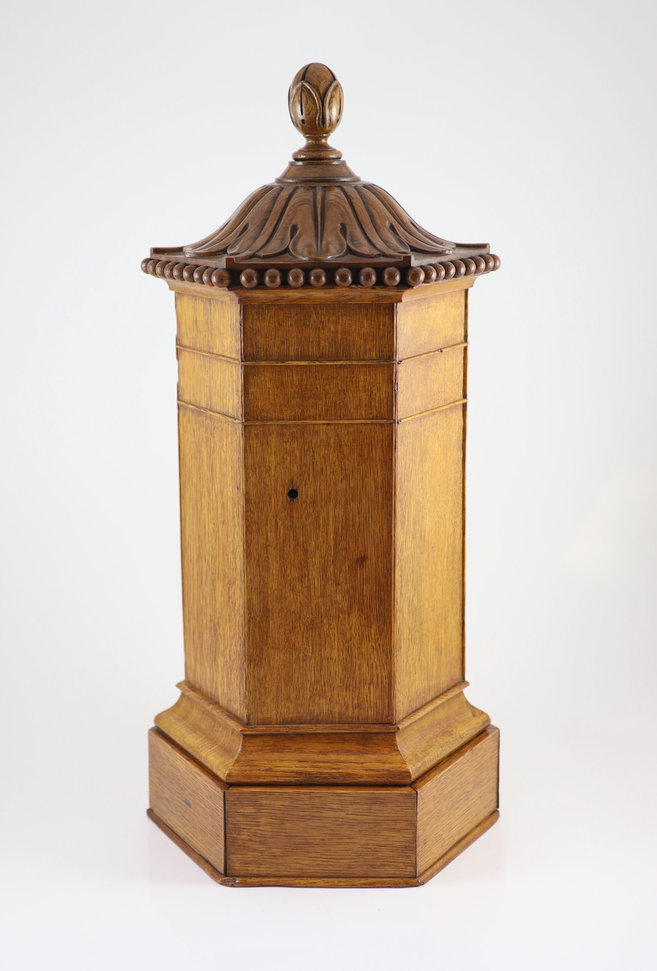 A Victorian oak hexagonal letter box, retailed by Walter Thornhill of 144 New Bond Street H 67cm. W 31cm. D. 26cm.